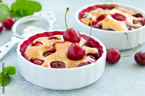 Cherry clafoutis - traditional French sweet fruit dessert. photo