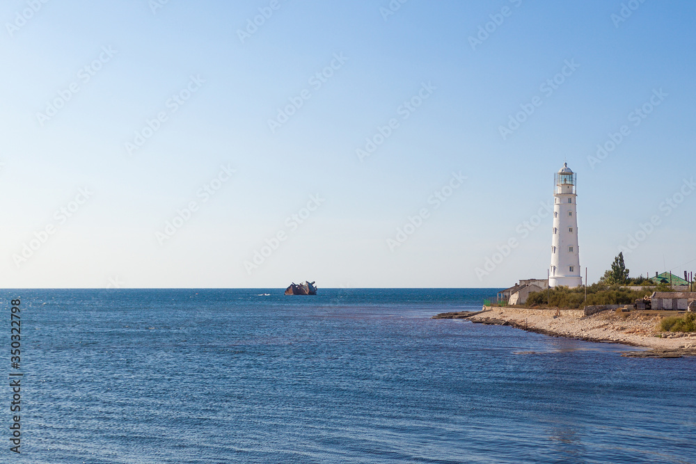 Panoramic view of the old lighthouse on a bright Sunny day. Cape Tarkhankut, Black sea, Republic of Crimea.