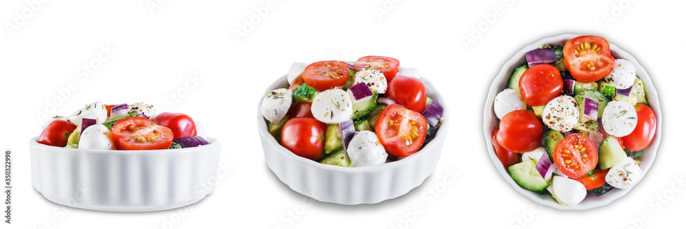 Tomato cucumber red onion mozzarella salad on a white isolated background Tomato cucumber red onion mozzarella salad on a white isolated background