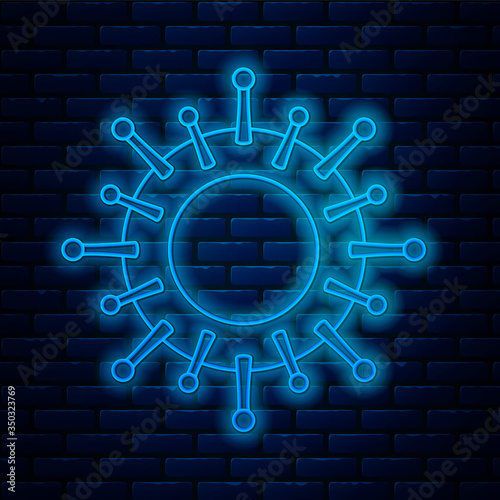 Glowing neon line Virus icon isolated on brick wall background. Corona virus 2019-nCoV. Bacteria and germs, cell cancer, microbe, fungi. Vector Illustration