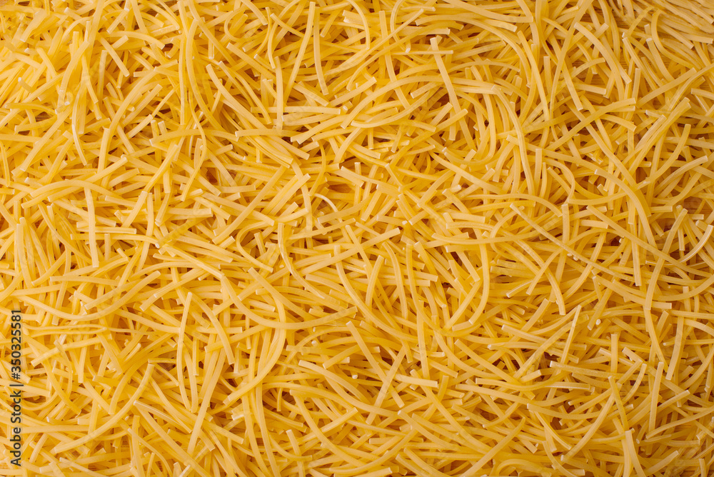 Photo of beautiful tiny asian dry pasta background, bio food Photo of beautiful tiny asian dry pasta background, bio food