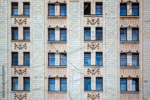 Huge local area network between rooms on the street. Wires between the windows. © Pavel