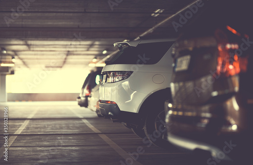 SUVs on multi-level parking in selective focus