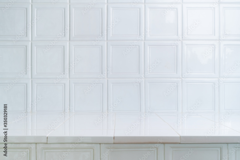 White ceramic oven tile background. Table like surface of vintage square bricks. Bright, modern interior design, brick pattern