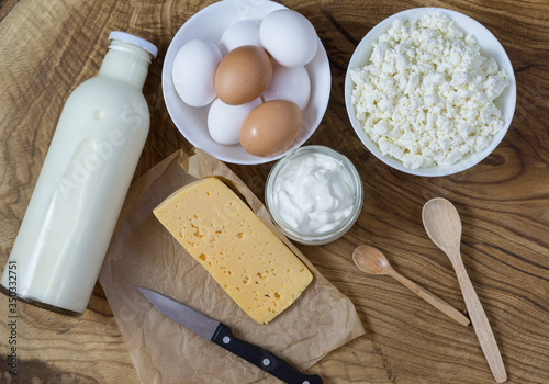 Village products on the Board: milk, cottage cheese, eggs, sour cream and cheese. Rich in calcium and vitamin D (Calciferol) food