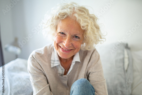 Close up smiling older woman relaxing at home