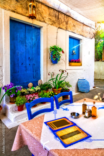 Typical street restaurants (taverns) of Greece. Paxos.IOnian island of Greece
