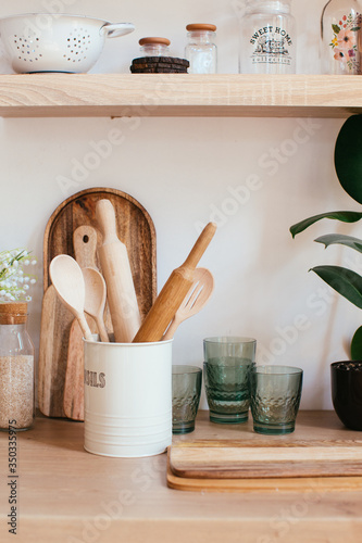 wooden rustic kitchen table. minimalistic interior, utencils on the table