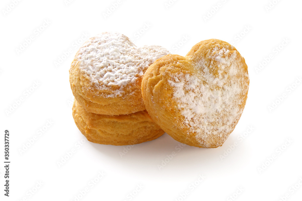heart shaped shortbread cookies with icing sugar on white background