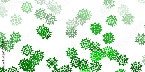 Light green vector background with christmas snowflakes.