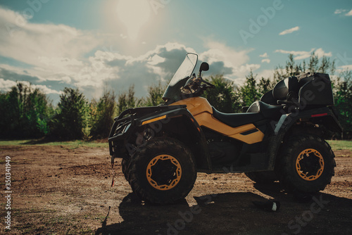 Yellow atv, quad in forest