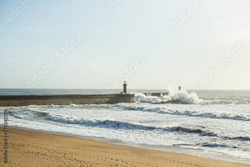 Surf and waves on the ocean embankment. Porto, Portugal.