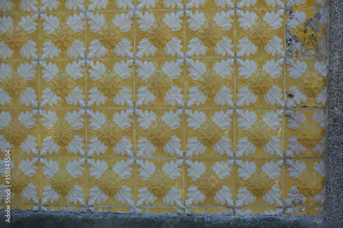 Traditional old tiles wall on the Porto streets, painted tin-glazed, azulejos ceramic tilework.