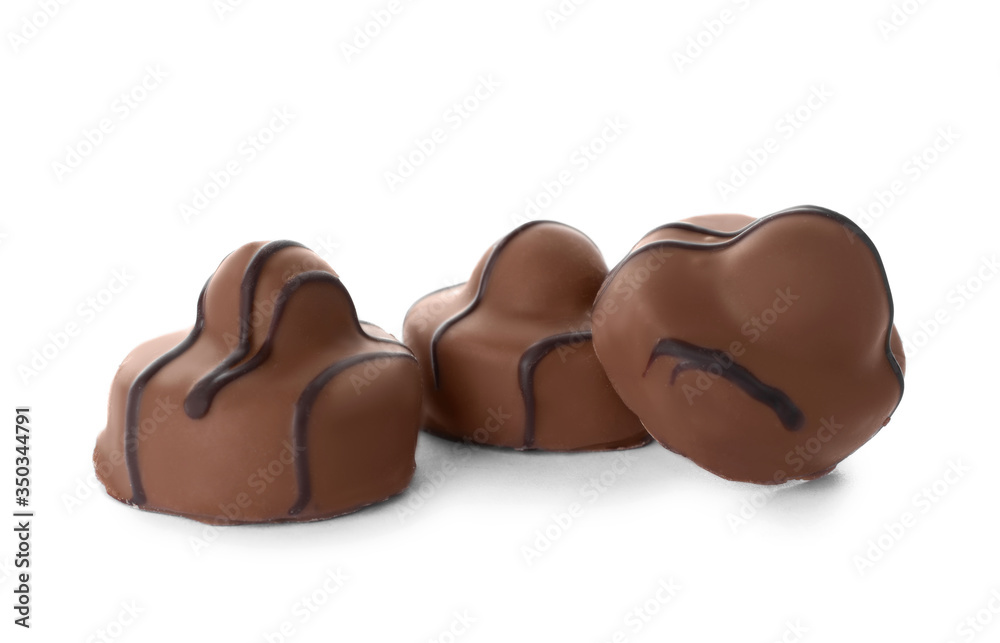 Delicious milk chocolate candies isolated on white Delicious milk chocolate candies isolated on white