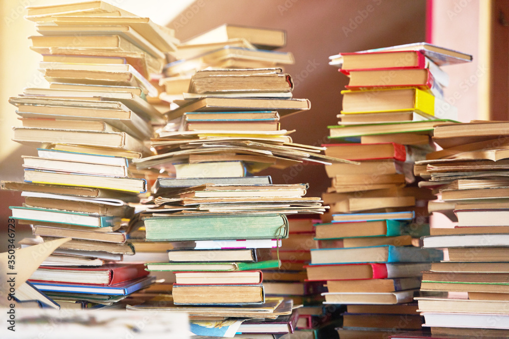 Pile of old books on the table. Lots of old books. Copy space Pile of old books on the table. Lots of old books. Copy space