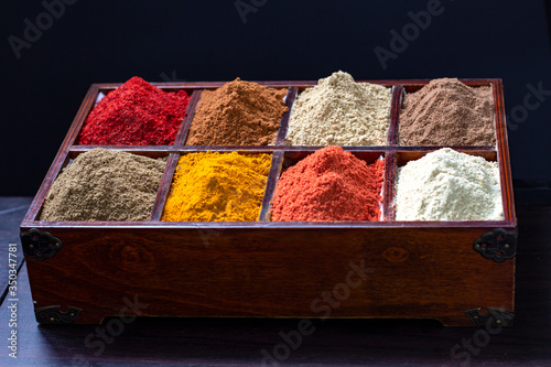 Vintage wooden box with a set of spices