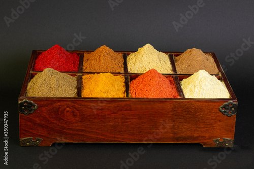 Vintage wooden box with a set of spices