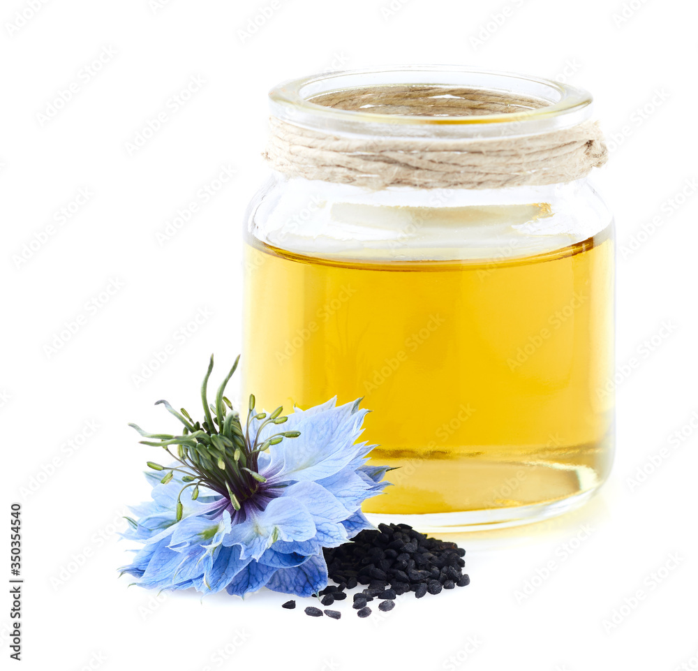 Black cumin oil on white background Black cumin oil on white background