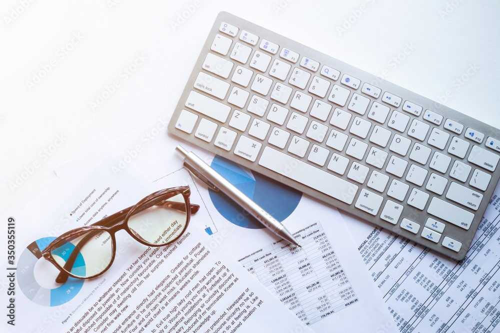 business accounter work with taxes and keyboard on white office desk ...