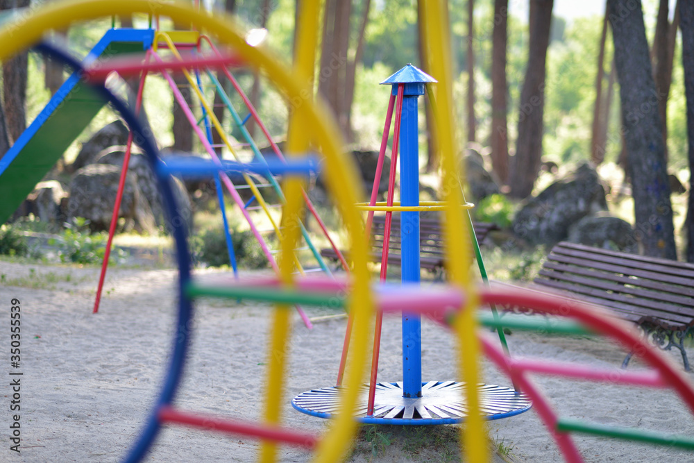 Playground with colorful swings outdoors.