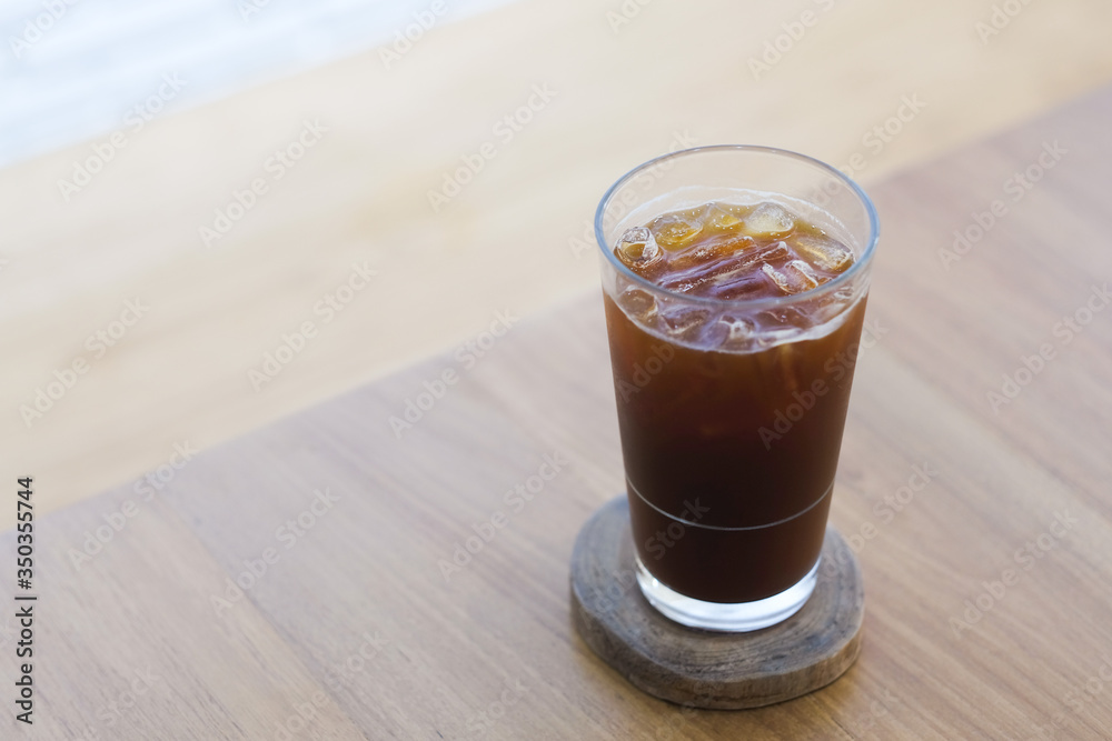 A glass of ice black coffee in cafe A glass of ice black coffee in cafe