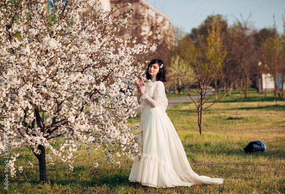 girl near a flowering spring tree girl near a flowering spring tree