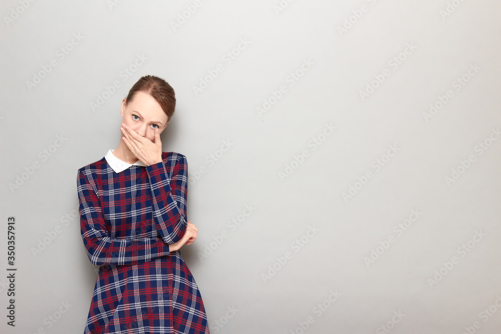 Portrait of sad unhappy girl covering mouth and being ready to cry Portrait of sad unhappy girl covering mouth and being ready to cry