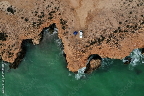 Plakat Car parked near cliff captured using drone