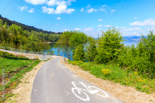 Cycleway around Czorsztynskie lake near Niedzica village on sunny spring day, Pieniny Mountains, Poland photo