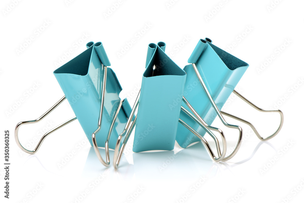 Four binder clips isolated on white background Four binder clips isolated on white background