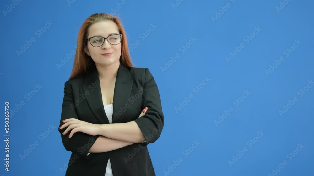 Portrait of business woman shaking yes with head on blue background. Serious woman changing emotions. Closeup female professional smiling at camera in studio. Confident woman portrait Portrait of business woman shaking yes with head on blue background. Serious woman changing emotions. Closeup female professional smiling at camera in studio. Confident woman portrait