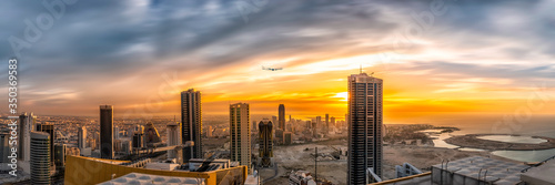 sunset over the sky line of Bahrain water front 