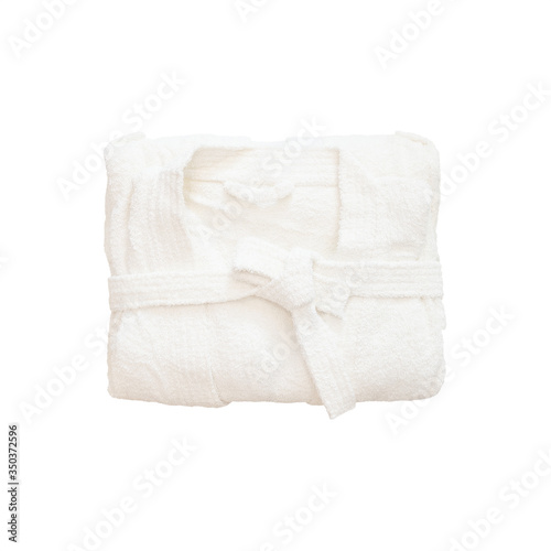 Folded white bathrobe isolated on white background