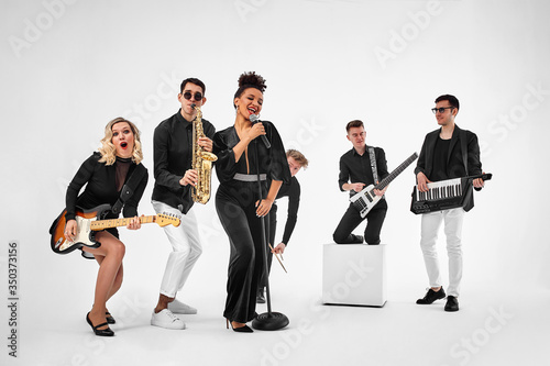 Photography photo of multi ethnic music band in studio