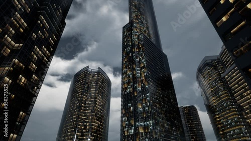 glass skyscrpaer office buildings with dark sky and clouds at storm photo