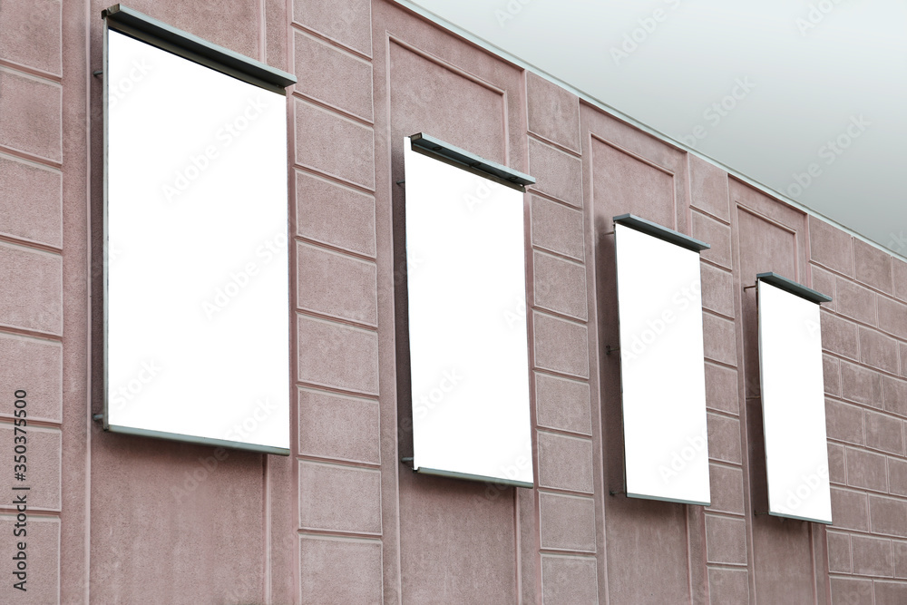 Blank banners on building facade outdoors. Advertising board design Blank banners on building facade outdoors. Advertising board design