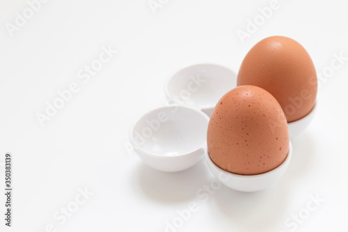 Organic eggs isolated on white background.