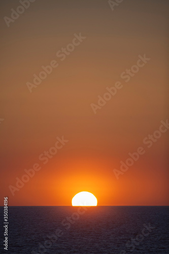 Sunset in the Mediterranean sea. Sun sky and clouds at sunset over the island of Majorca. © adradaguajardo
