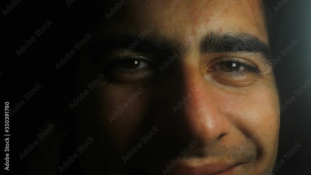 Partial view of a smiling man's face Partial view of a smiling man's face