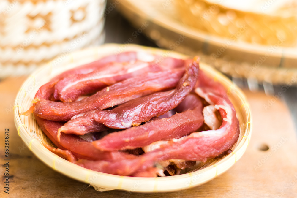 Dried meat in a bamboo dish with Kratib glutinous rice,