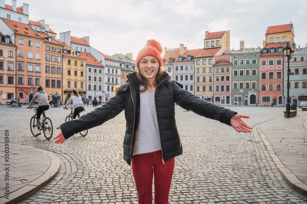 Young woman in the old town of warsaw, poland