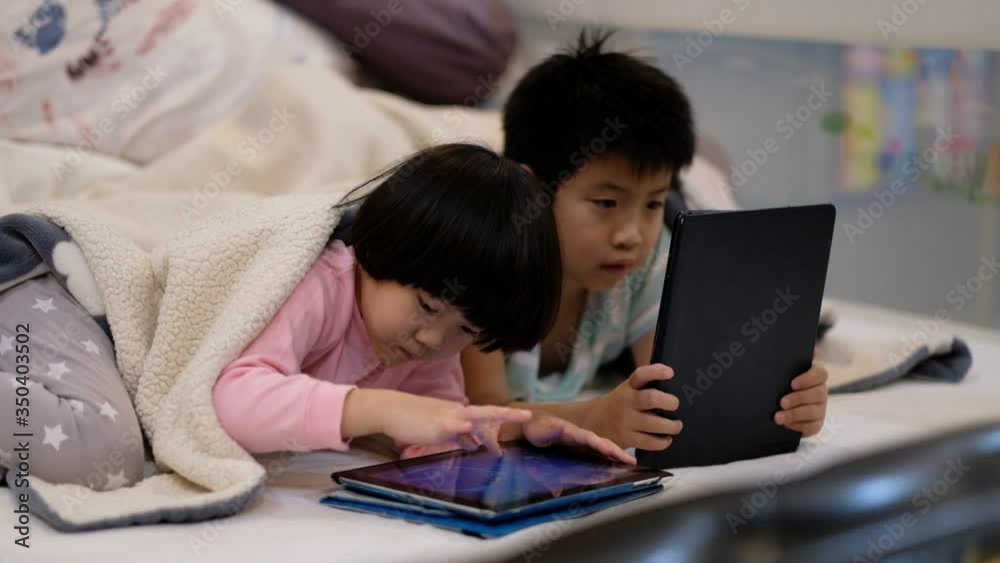 two chinese children addicted tablet, asian child watching tablet, kid use telephone together on their bed, play phone, kid addict smartphone
two chinese children addicted tablet, asian child watching tablet, kid use telephone together on their bed, play phone, kid addict smartphone