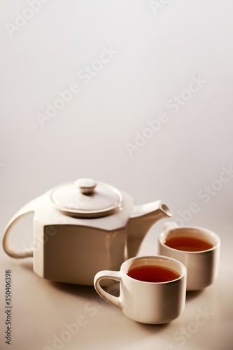 A tea pot and two cup of tea