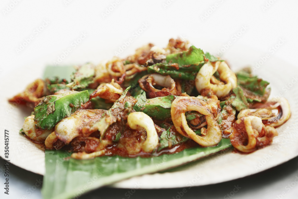 Baked squid with vegetables and spicy sauce Baked squid with vegetables and spicy sauce