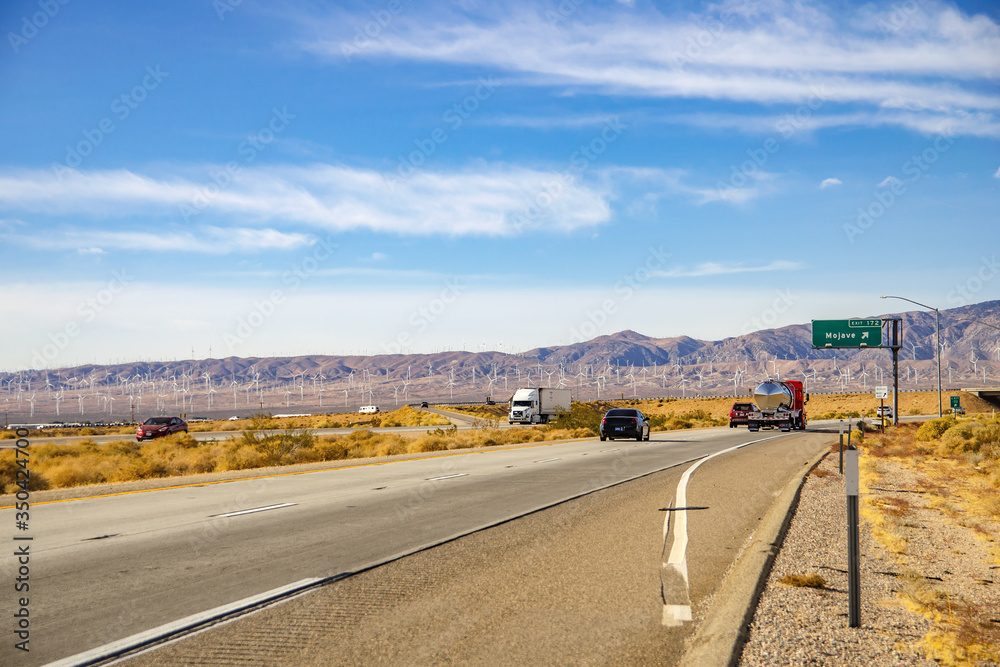 Fototapeta premium Car rides along the Mojave Desert, California