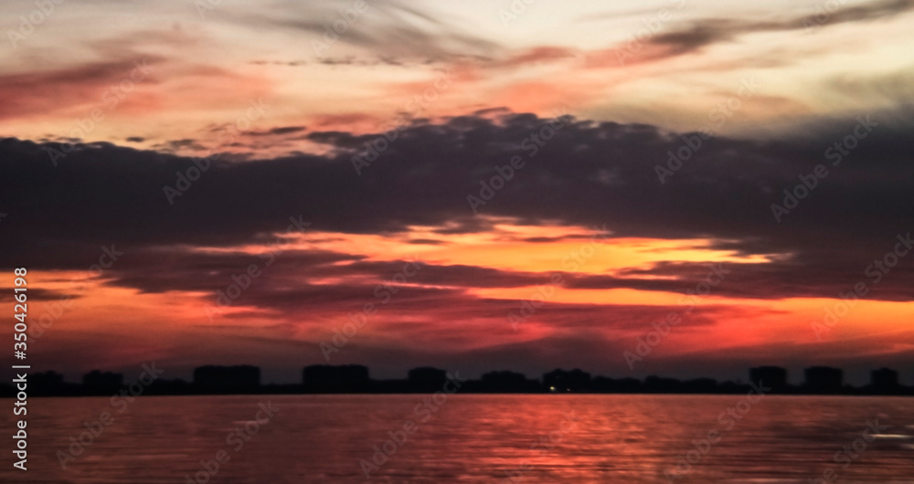 sunset over the city, sea, sky, water, skyline, cityscape, red, clouds, reflection, beauty