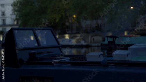 A close up shot of a smoking Chimney stove flue on a Narrow Boat in Little Venice, London UK. photo