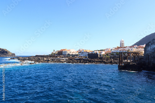 Fototapeta Naklejka Na Ścianę i Meble -  Coastline and town Garachico panorama with Atlantic Ocean on Canary Island Tenerife, Spain