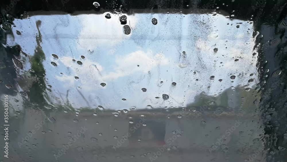 view inside car washing machine shampoo and foam injection to car mirror for cleaning. smart Automatic robot working wet water view inside car washing machine shampoo and foam injection to car mirror for cleaning. smart Automatic robot working wet water