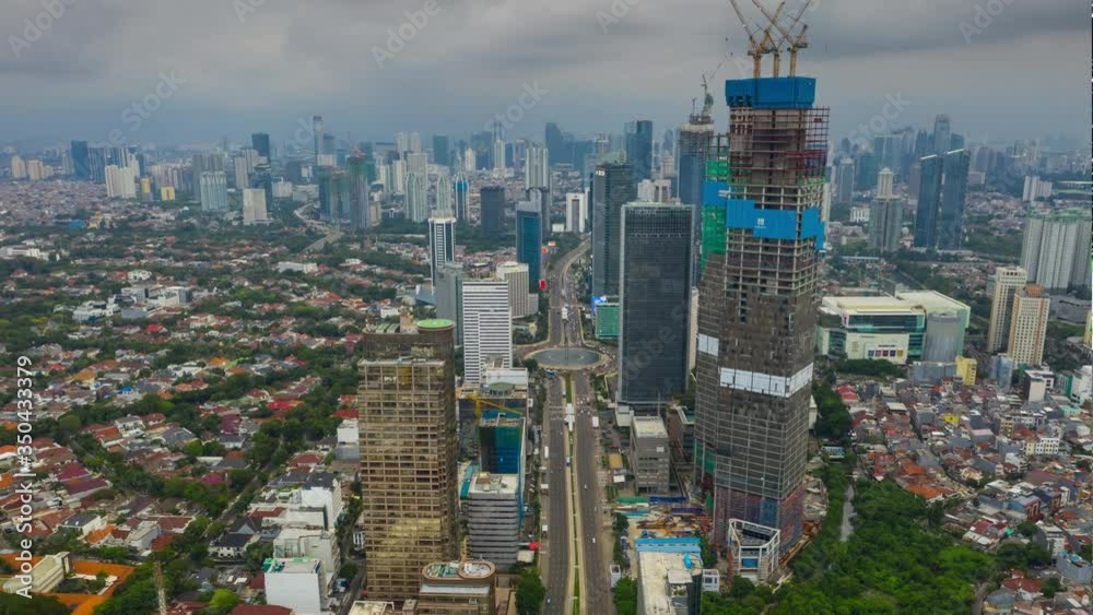 rainy sky jakarta city center traffic street skyscraper construction aerial timelapse panorama 4k indonesia rainy sky jakarta city center traffic street skyscraper construction aerial timelapse panorama 4k indonesia